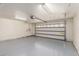 Spacious garage with epoxy flooring, ready for your vehicles and projects at 1114 N Leland Ct, Gilbert, AZ 85233