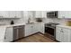 The modern kitchen features stainless steel appliances, white cabinets, and quartz countertops at 1114 N Leland Ct, Gilbert, AZ 85233