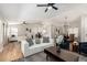 Open-concept living room flows into dining area, featuring modern decor and plenty of natural light at 1114 N Leland Ct, Gilbert, AZ 85233