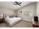 Relaxing main bedroom with ceiling fan, neutral tones, and a bright window at 1114 N Leland Ct, Gilbert, AZ 85233