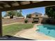 Serene backyard with a private pool, swing, and well-maintained landscaping for ultimate relaxation at 113 N Albert Dr, Chandler, AZ 85226