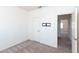 Simple carpeted bedroom showing the ensuite entry and a wall mount at 113 N Albert Dr, Chandler, AZ 85226