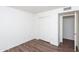 Clean bedroom features wood floors, neutral walls, and closet space at 113 N Albert Dr, Chandler, AZ 85226