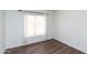 Bright bedroom with hardwood floors, large window, and neutral decor at 113 N Albert Dr, Chandler, AZ 85226