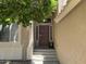 Inviting front door with decorative accents and covered entry providing a welcoming entrance to the home at 113 N Albert Dr, Chandler, AZ 85226