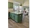 Kitchen island offering additional workspace and seating, seamlessly blending into the cozy living area at 113 N Albert Dr, Chandler, AZ 85226