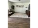 Inviting living room features wood floors, neutral tones, area rug, and bright natural lighting at 113 N Albert Dr, Chandler, AZ 85226