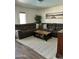 Comfortable living room featuring a plush sectional sofa and a stylish coffee table at 113 N Albert Dr, Chandler, AZ 85226