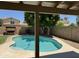 Scenic view of the refreshing pool area surrounded by lush greenery and mature trees at 113 N Albert Dr, Chandler, AZ 85226