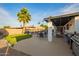 A backyard showcases pool, patio, BBQ, and seating for outdoor relaxation at 12866 W Orange Dr, Litchfield Park, AZ 85340
