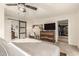 Bedroom features include carpet floors, bed, ceiling fan, TV, and a walk-in closet at 12866 W Orange Dr, Litchfield Park, AZ 85340