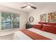 Bedroom showcasing a window with blinds, dark dresser, and artwork at 12866 W Orange Dr, Litchfield Park, AZ 85340