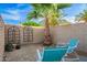 Secluded courtyard with lounge chairs surrounded by brick walls and landscaping at 12866 W Orange Dr, Litchfield Park, AZ 85340
