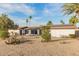Exterior of a single story home with solar panels on the roof at 12866 W Orange Dr, Litchfield Park, AZ 85340