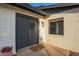 Charming front entrance with double doors, wreath, and a 'hello' doormat at 12866 W Orange Dr, Litchfield Park, AZ 85340