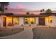 Charming home with a freshly painted exterior, updated landscaping and walkway, and beautiful curb appeal at 12866 W Orange Dr, Litchfield Park, AZ 85340