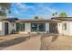 Charming home with a freshly painted exterior, updated landscaping and walkway, and beautiful curb appeal at 12866 W Orange Dr, Litchfield Park, AZ 85340