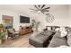 Bright living room with modern decor, a large TV, and a comfortable sectional sofa at 12866 W Orange Dr, Litchfield Park, AZ 85340