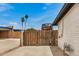 The gated parking area beside the house and garage offers secure storage for RV or other equipment at 12866 W Orange Dr, Litchfield Park, AZ 85340