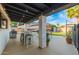 Covered patio includes ample seating and views of the RV and backyard space at 12866 W Orange Dr, Litchfield Park, AZ 85340