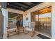 Covered patio with brick columns, patio furniture, and string lights at 12866 W Orange Dr, Litchfield Park, AZ 85340