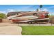 RV parked next to a lush lawn; a modern design with sleek lines and eye-catching color schemes at 12866 W Orange Dr, Litchfield Park, AZ 85340