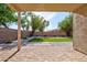 View of brick-paved patio and synthetic lawn, offering a clean, low-maintenance outdoor space at 13170 W Clarendon Ave, Litchfield Park, AZ 85340