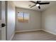 Bedroom featuring wood-look tile floors and a view of the neighborhood at 13170 W Clarendon Ave, Litchfield Park, AZ 85340