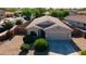 Lovely home featuring desert landscaping and a private two-car garage, creating curb appeal at 13170 W Clarendon Ave, Litchfield Park, AZ 85340
