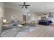 Open concept living room connects to a kitchen with a center island, offering a seamless entertaining area at 13170 W Clarendon Ave, Litchfield Park, AZ 85340