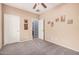 Neutral bedroom with carpeted floor, white doors and a view to the next room at 15551 W Poinsettia Dr, Surprise, AZ 85379