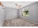 Inviting bedroom with neutral paint, plush carpet, and natural light at 15551 W Poinsettia Dr, Surprise, AZ 85379