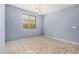 Dining room features a tile floor, single window, and a modern chandelier at 15551 W Poinsettia Dr, Surprise, AZ 85379