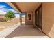 Spacious covered patio with access to backyard and direct entrance into the home at 15551 W Poinsettia Dr, Surprise, AZ 85379