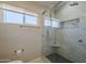 Elegant bathroom with a frameless glass shower, marble tile, and a built-in niche for added convenience at 1610 W Maplewood St, Chandler, AZ 85286