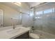 Stylish bathroom featuring a modern vanity, framed mirror, and shower with a sleek glass door at 1610 W Maplewood St, Chandler, AZ 85286