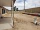 Large backyard with blank canvas for landscaping, covered patio, and cinder block wall at 1623 E Fremont Rd, Phoenix, AZ 85042