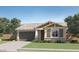 Charming single-story home with a two-car garage, covered entryway, and landscaped front yard at 16714 W Audrey Ln, Surprise, AZ 85387