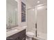 Modern bathroom with sleek vanity, shower with glass doors, and stylish fixtures at 16739 W Charlotte Dr, Surprise, AZ 85387