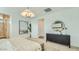 Tranquil bedroom featuring a comfortable bed, stylish dresser, and modern decor at 16739 W Charlotte Dr, Surprise, AZ 85387