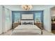 Stylish bedroom with a comfortable bed, elegant lighting, and calming decor at 16739 W Charlotte Dr, Surprise, AZ 85387