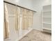 Spacious walk-in closet with shelving and hanging storage for optimal organization at 16739 W Charlotte Dr, Surprise, AZ 85387