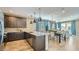 Well-appointed kitchen open to the dining area, featuring stainless steel appliances and ample counter space at 16739 W Charlotte Dr, Surprise, AZ 85387