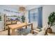 Bright home office features a large desk, stylish decor, and plenty of natural light at 16739 W Charlotte Dr, Surprise, AZ 85387