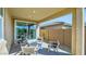 Relaxing covered patio with comfortable seating, ideal for enjoying the outdoors at 16739 W Charlotte Dr, Surprise, AZ 85387
