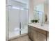 Modern bathroom featuring a glass-enclosed shower, sleek vanity, and contemporary fixtures at 16933 W Bronco Trl, Surprise, AZ 85387