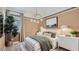 Charming bedroom showcasing a comfortable bed, modern lighting, and stylish decor at 16933 W Bronco Trl, Surprise, AZ 85387