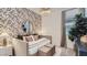 Cozy bedroom featuring a daybed with peach-themed wallpaper, and stylish decor at 16933 W Bronco Trl, Surprise, AZ 85387