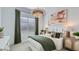 Stylish bedroom with a large bed, decorative art, and a relaxing atmosphere at 16933 W Bronco Trl, Surprise, AZ 85387