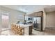 Modern kitchen boasting an island, stainless steel appliances, and bright lighting at 16933 W Bronco Trl, Surprise, AZ 85387